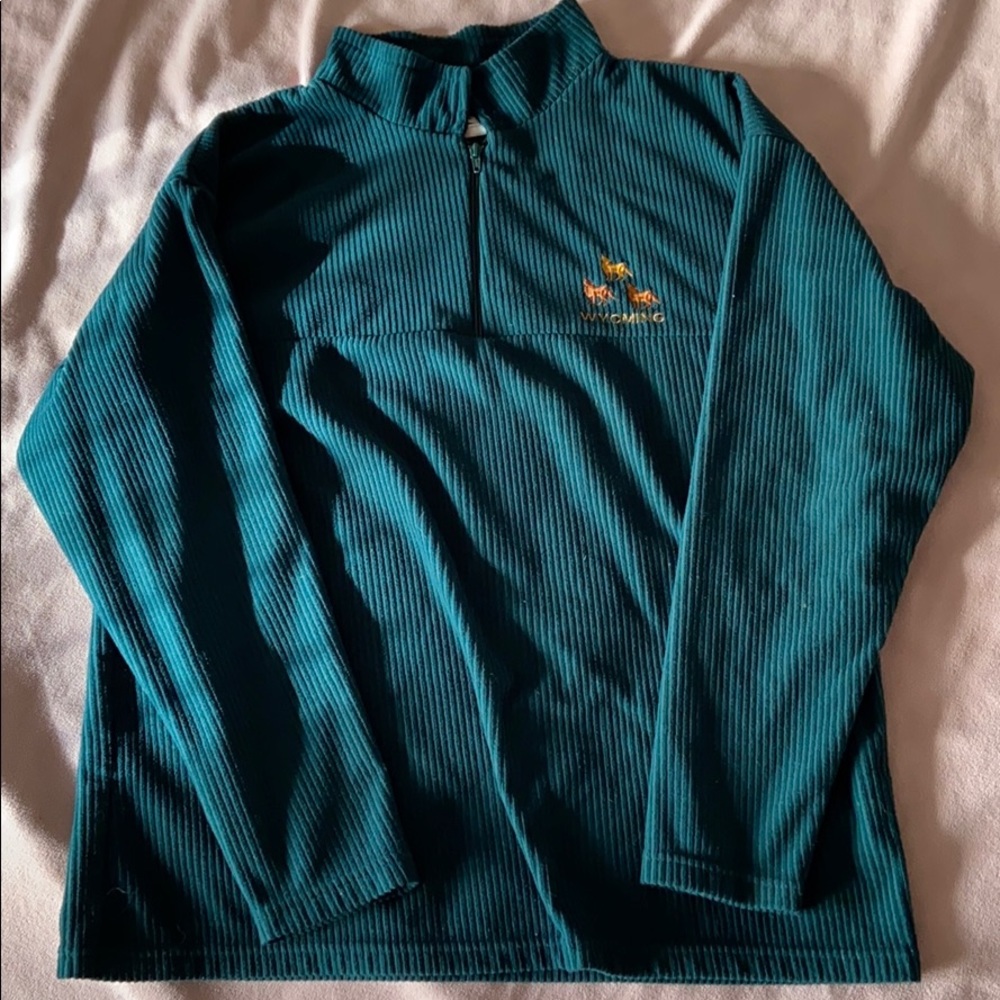 Forest green jacket with golden Wyoming lettering